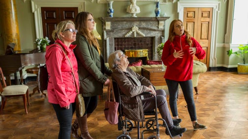 Visitors in the entrance hall at Castle Ward, County Down